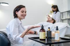 Cosmetologist working with the client in a spa salon